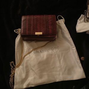 Michael Kors jade clutch in snakeskin